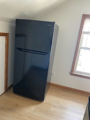 52 Forest Street, Unit 3 Fall River, MA 02721 - Photo 9 of 10 an empty room with wooden floor and window