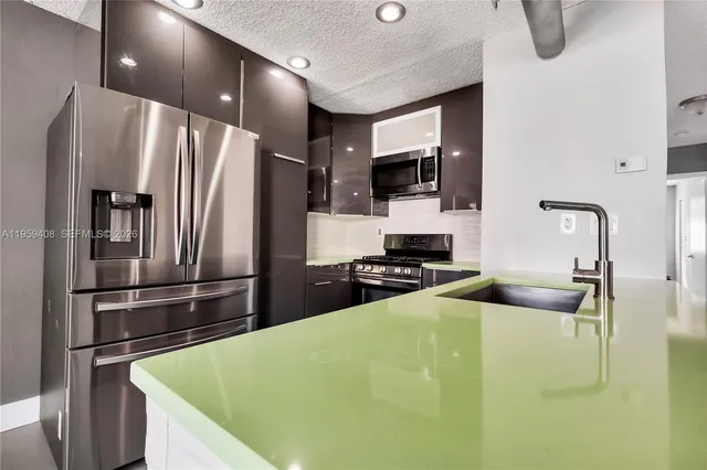 a bathroom with a bathtub shower sink vanity and toilet