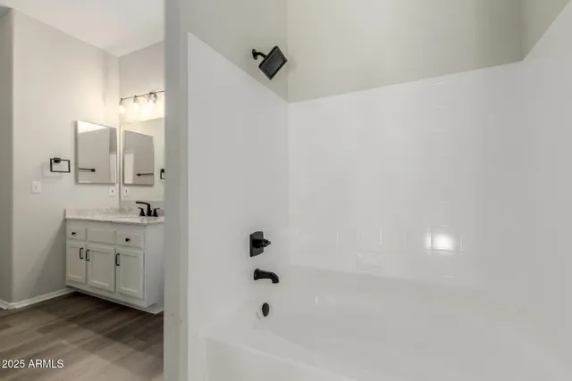 a bathroom with a bathtub and a shower
