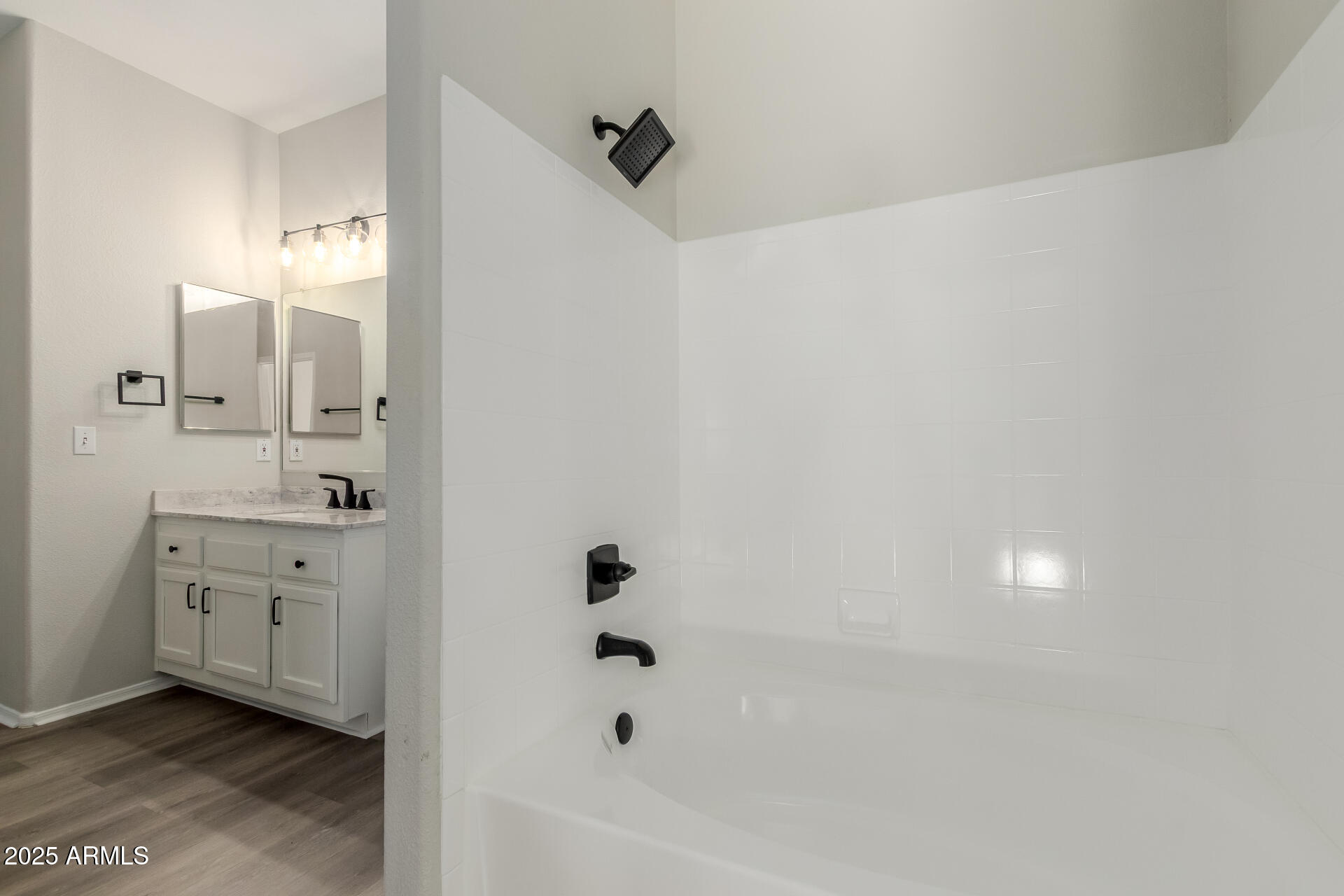 4644 North 22nd Street, Unit 1161 Phoenix, AZ 85016 - Photo 14 of 25 a bathroom with a bathtub and a shower