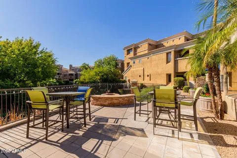 a view of a patio with table and chairs and potted plants