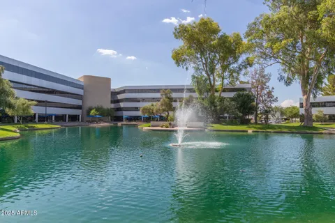 a view of swimming pool from a lake view