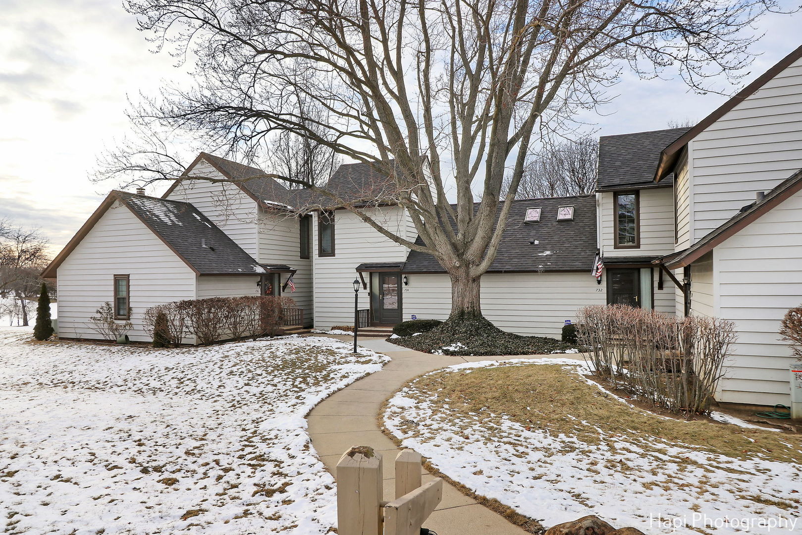 734 Chandler Road Gurnee, IL 60031 - Photo 20 of 26 a view of a house with a yard covered in snow