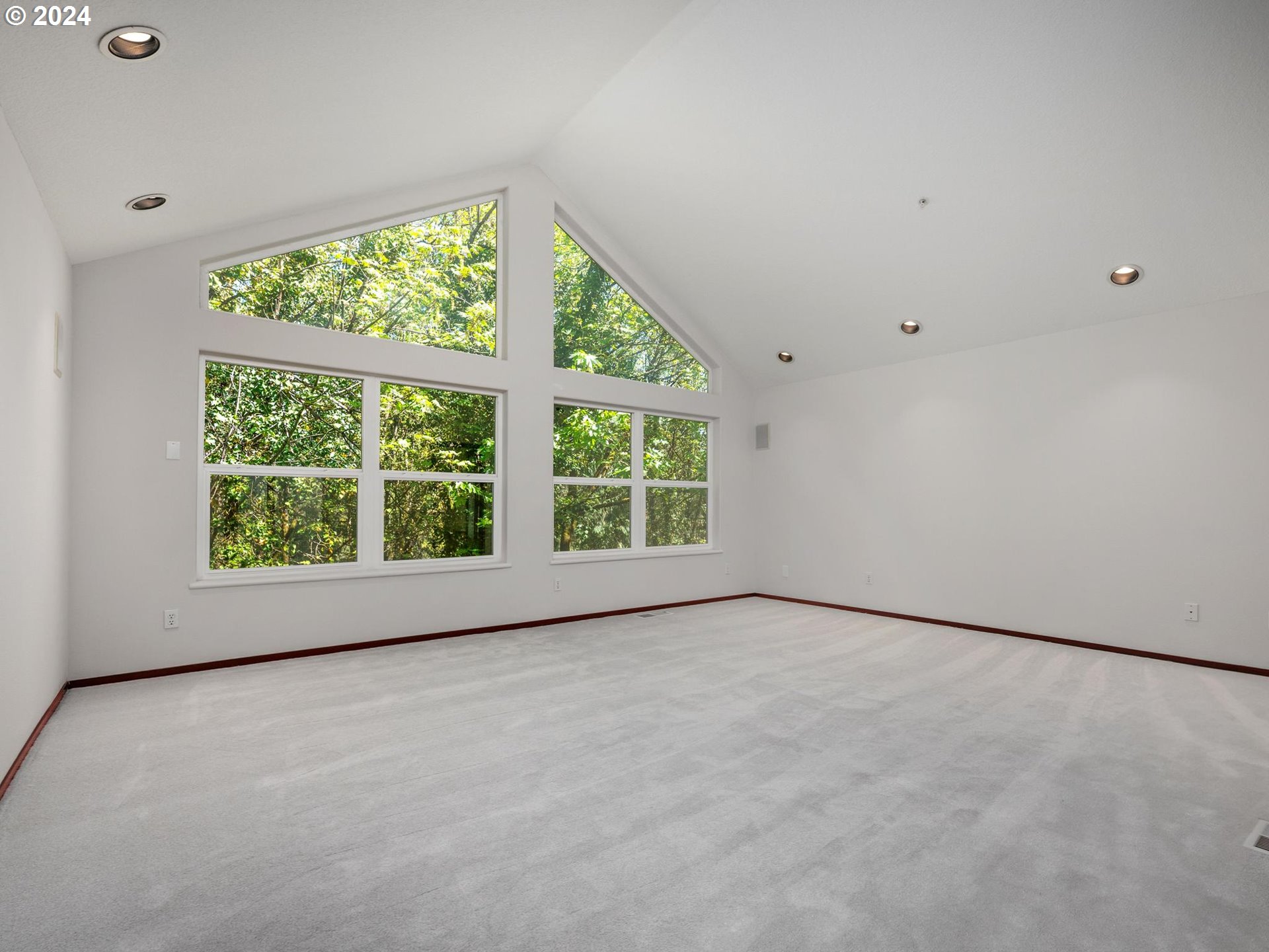 6254 Southwest Burlingame Avenue, Unit A Portland, OR 97239 - Photo 17 of 44 a view of an empty room with a window