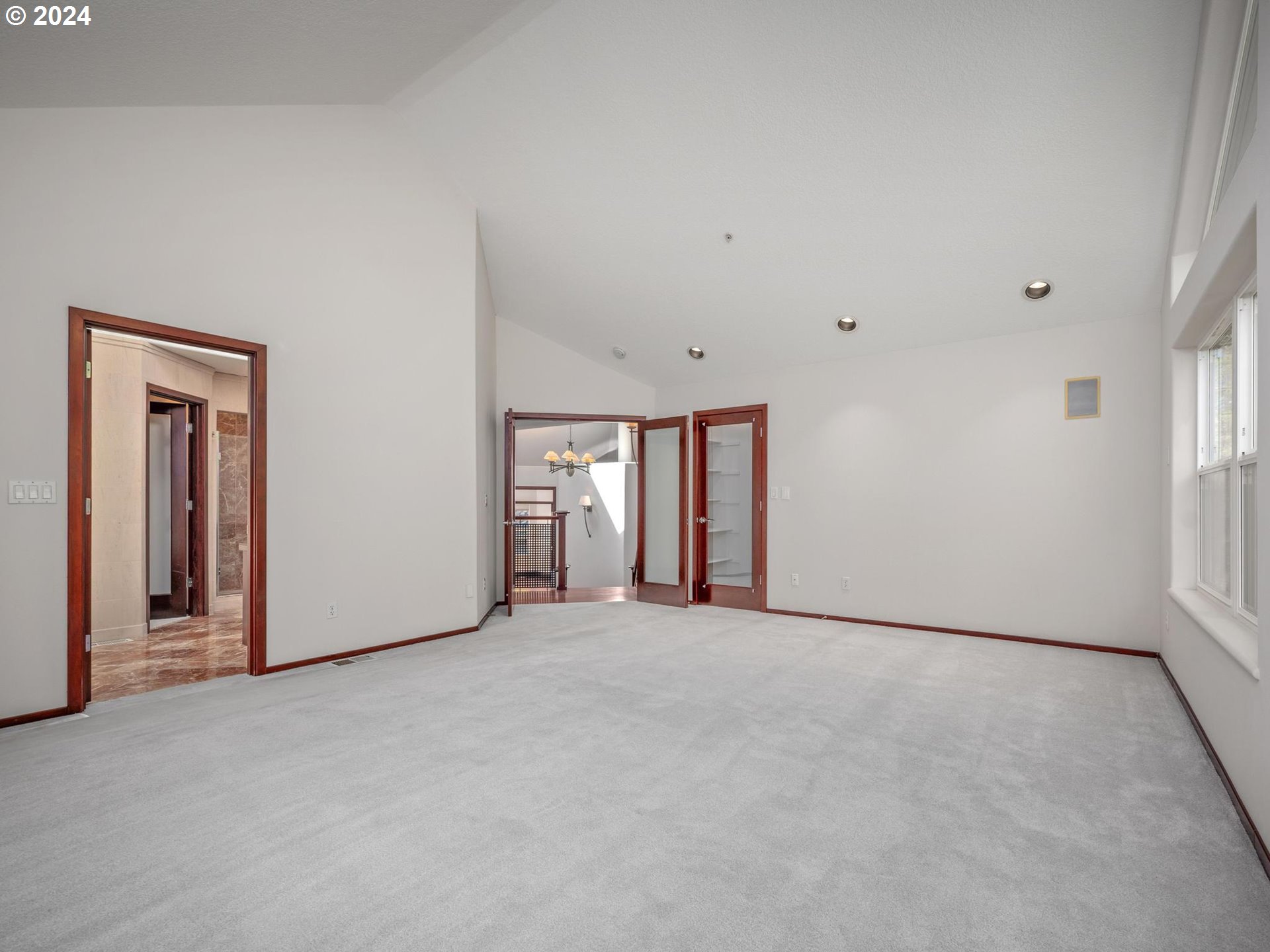 6254 Southwest Burlingame Avenue, Unit A Portland, OR 97239 - Photo 18 of 44 an empty room with windows