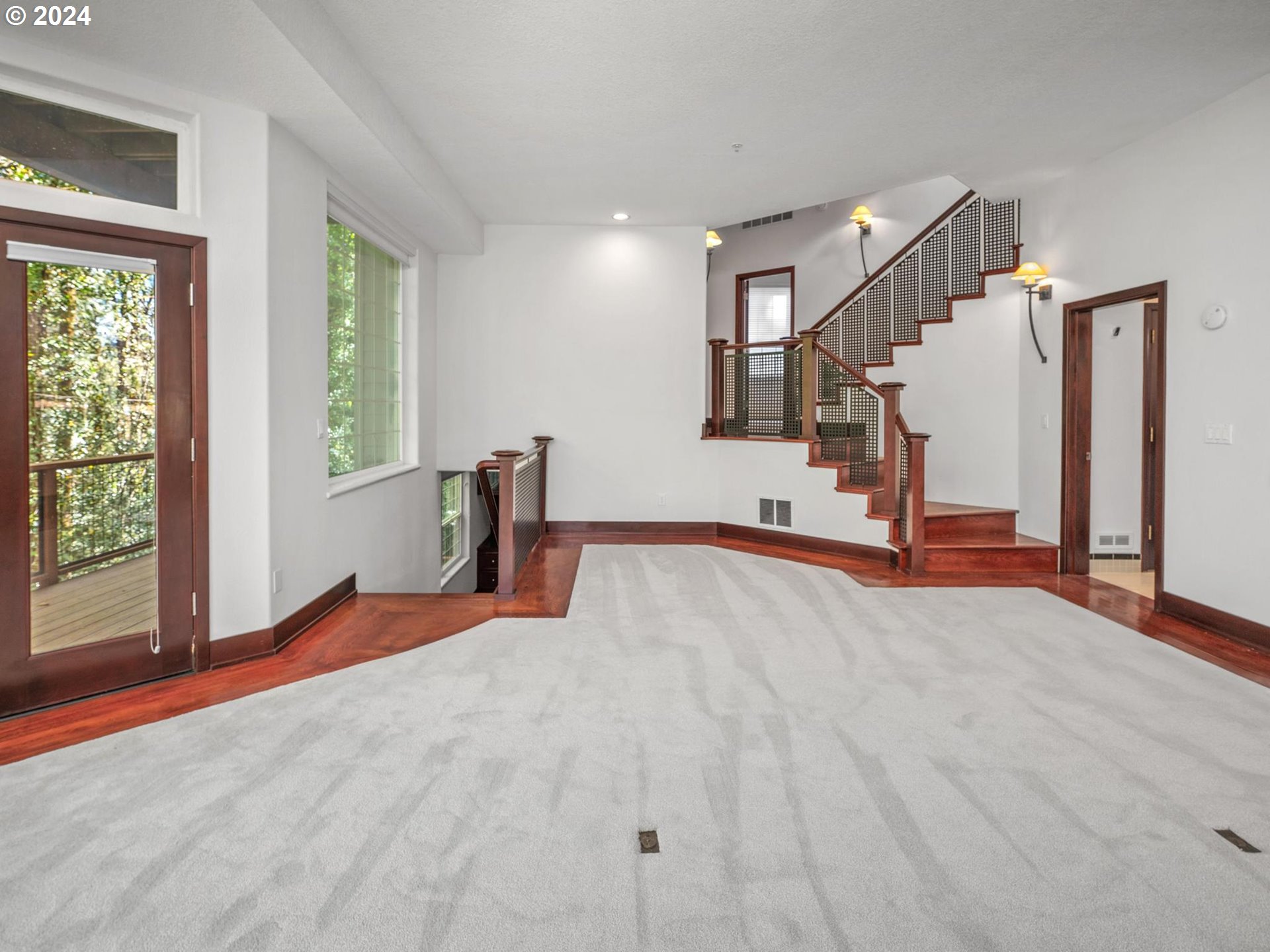 6254 Southwest Burlingame Avenue, Unit A Portland, OR 97239 - Photo 23 of 44 a view of an empty room with a window