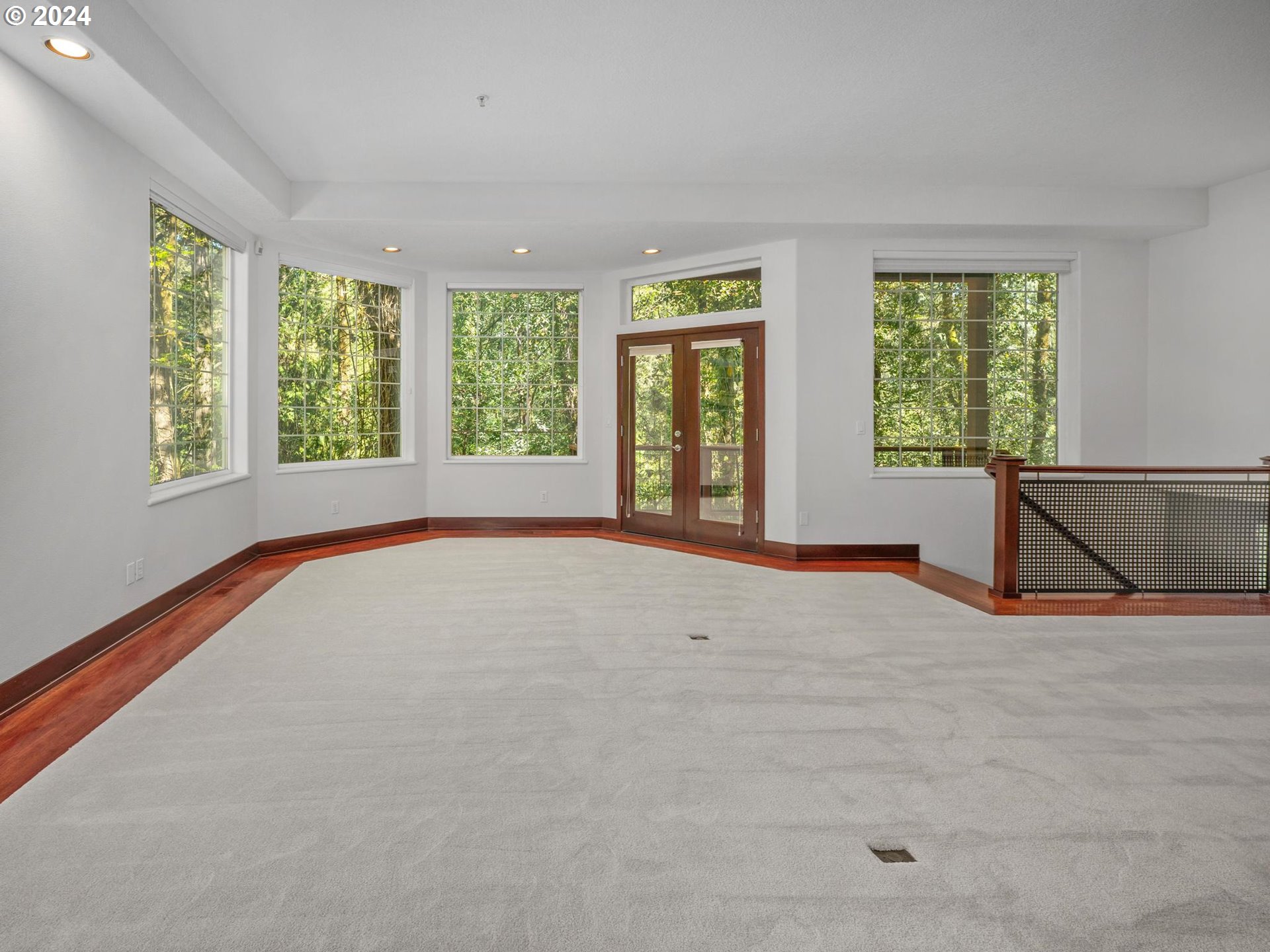 6254 Southwest Burlingame Avenue, Unit A Portland, OR 97239 - Photo 25 of 44 a view of an empty room with a window