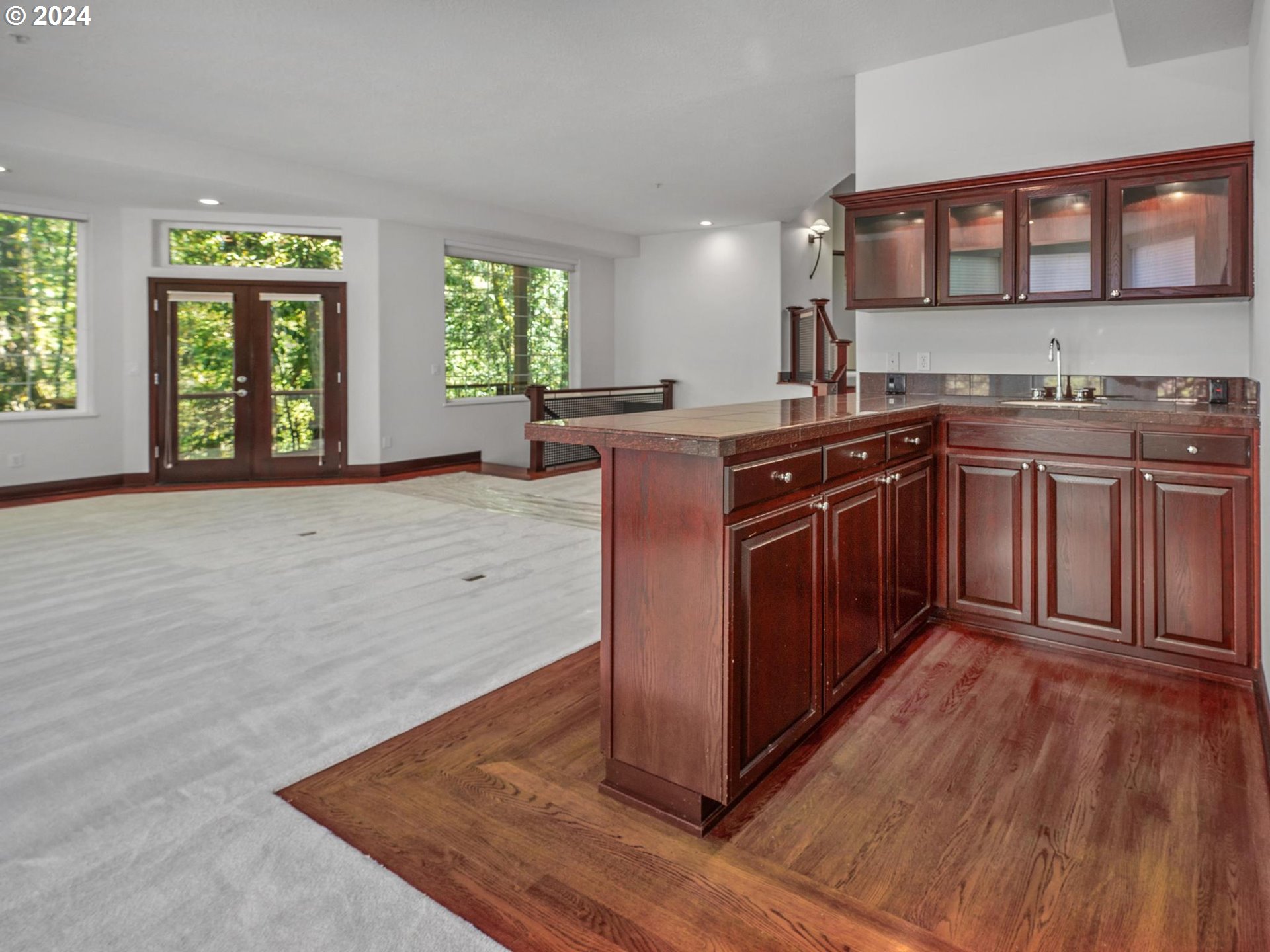 6254 Southwest Burlingame Avenue, Unit A Portland, OR 97239 - Photo 26 of 44 a kitchen with stainless steel appliances granite countertop a stove a sink and a microwave