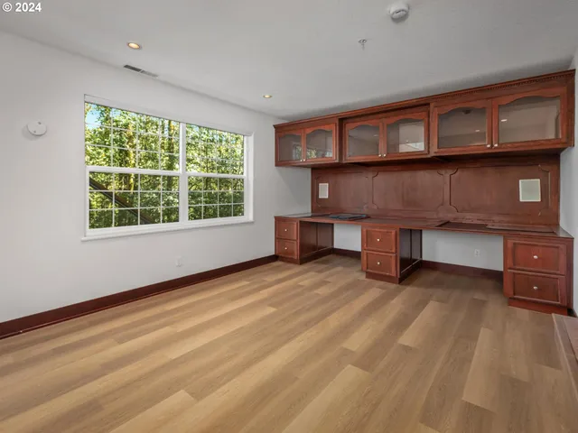 a bathroom with a sink toilet and a mirror
