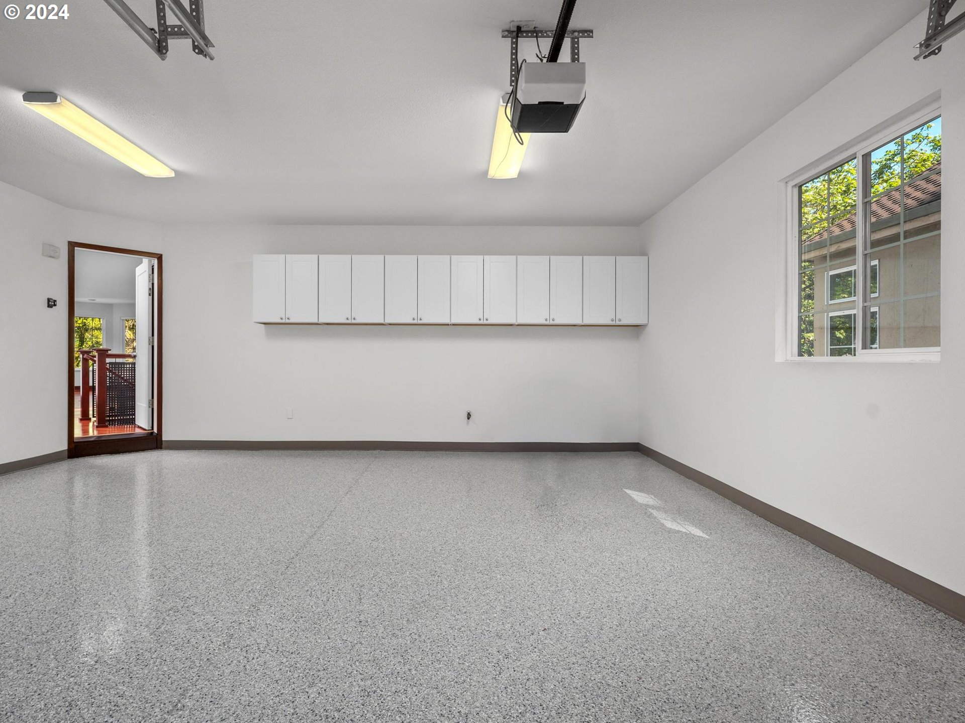 6254 Southwest Burlingame Avenue, Unit A Portland, OR 97239 - Photo 37 of 44 an empty room with windows