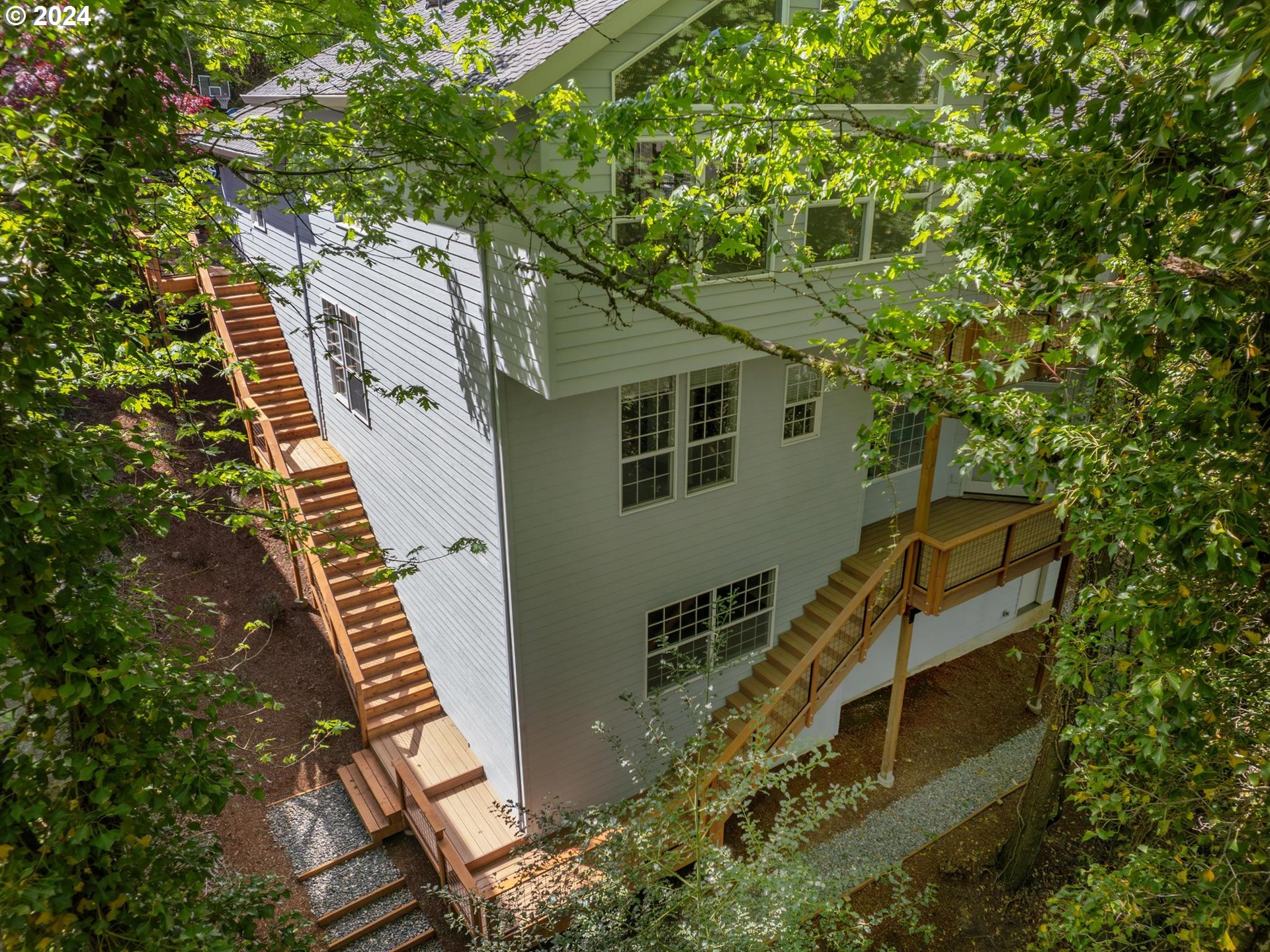 6254 Southwest Burlingame Avenue, Unit A Portland, OR 97239 - Photo 44 of 44 a view of a house with a tree