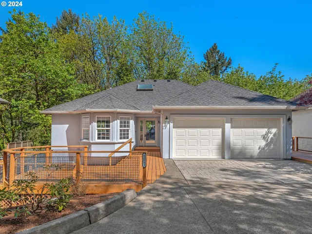 a view of a hallway with furniture and windows