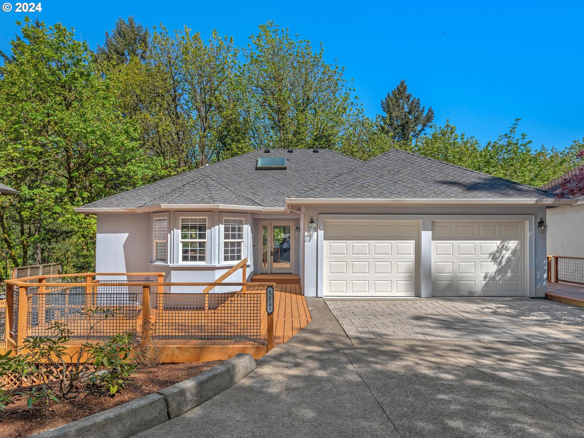 6254 Southwest Burlingame Avenue, Unit A Portland, OR 97239 - Photo 6 of 44 a front view of a house with garden
