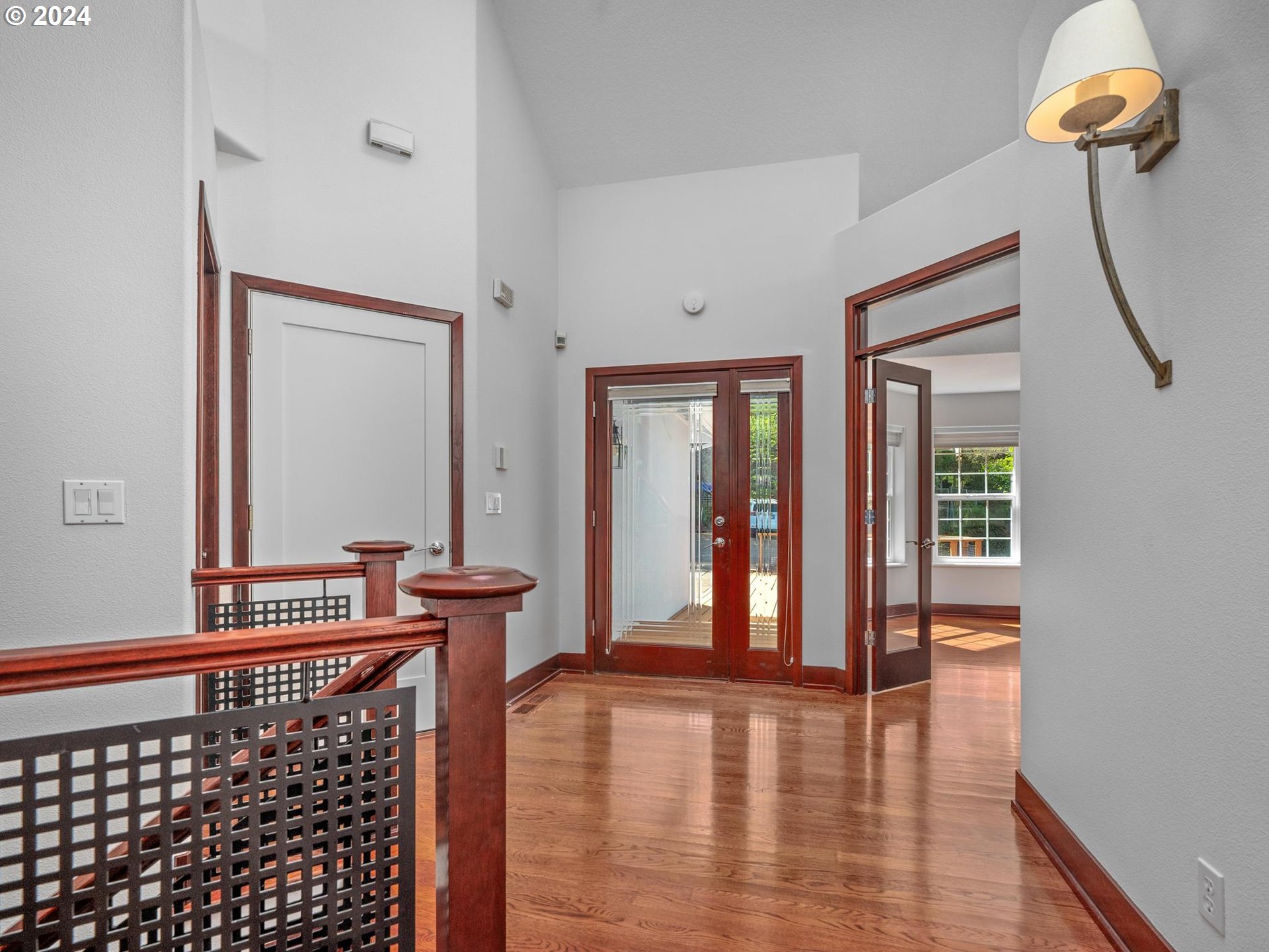 6254 Southwest Burlingame Avenue, Unit A Portland, OR 97239 - Photo 7 of 44 a view of a hallway with furniture and windows