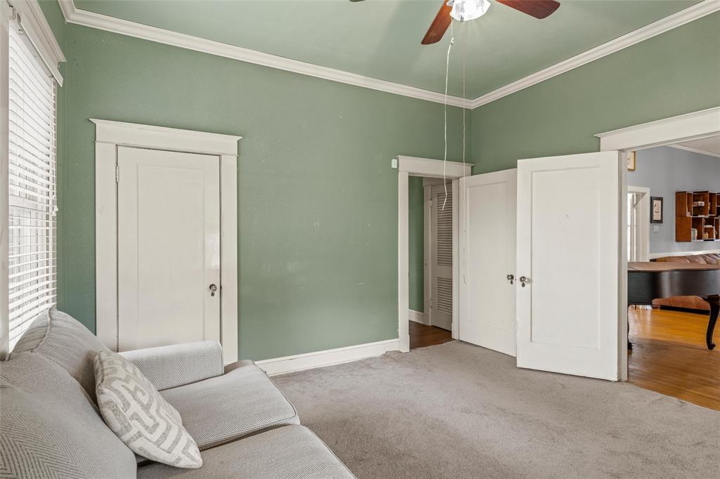 2717 Colcord Avenue Waco, TX 76707 - Photo 11 of 34 a living room with furniture and a chandelier