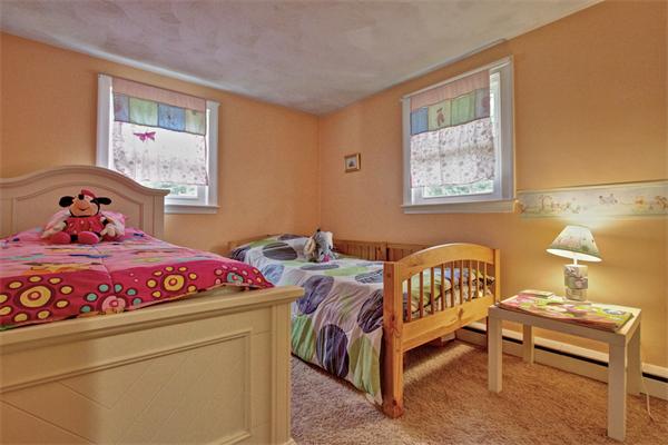 753 Potter Road Framingham, MA 01701 - Photo 13 of 25 a bedroom with a bed and a window