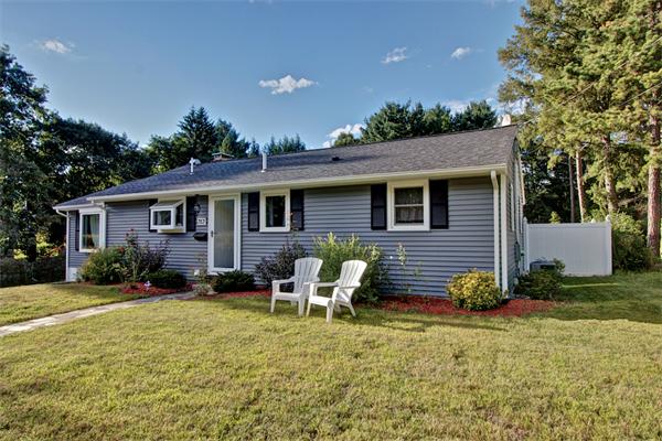 753 Potter Road Framingham, MA 01701 - Photo 3 of 25 a view of a house with backyard sitting area and garden