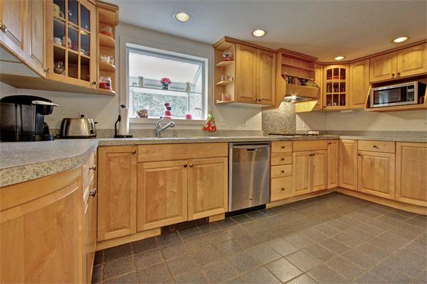 753 Potter Road Framingham, MA 01701 - Photo 5 of 25 a kitchen with a sink and cabinets