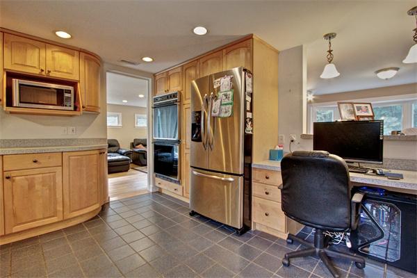 753 Potter Road Framingham, MA 01701 - Photo 7 of 25 a kitchen with stainless steel appliances granite countertop a refrigerator stove and microwave