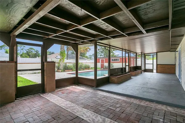 a view of an empty room with a balcony