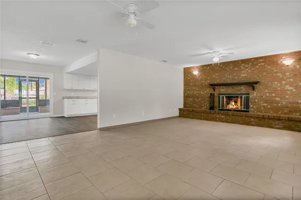 a view of an empty room and a window