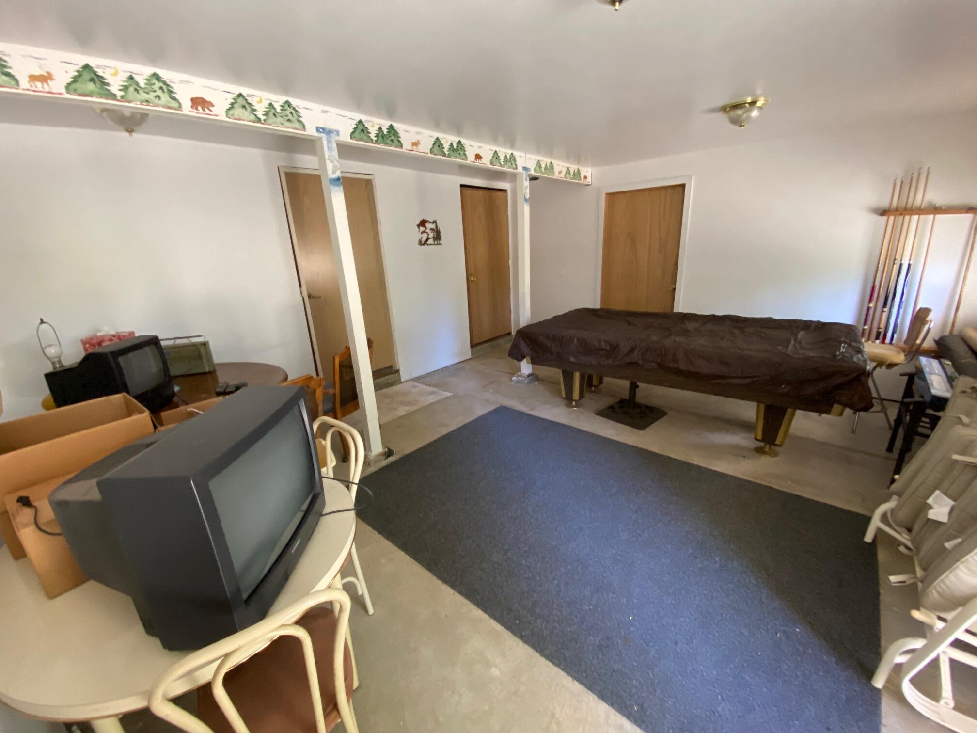 581 Mountain Aire Road Trinity Center, CA 96091 - Photo 14 of 48 Family room in downstairs of main house