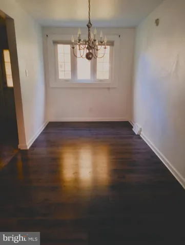 a kitchen with a stove top oven and cabinets