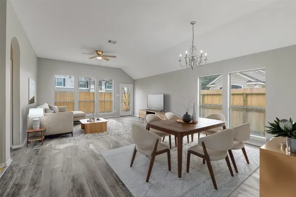 a living room with furniture and a table