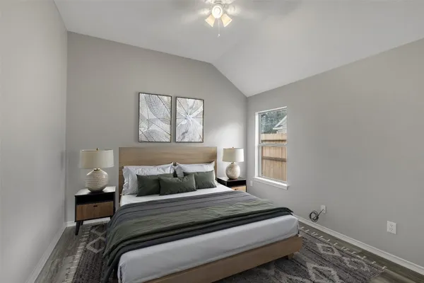 a bedroom with a bed and a window