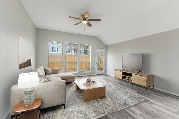 a living room with furniture and a window