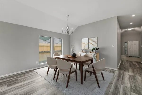 a view of a dining room with furniture and window