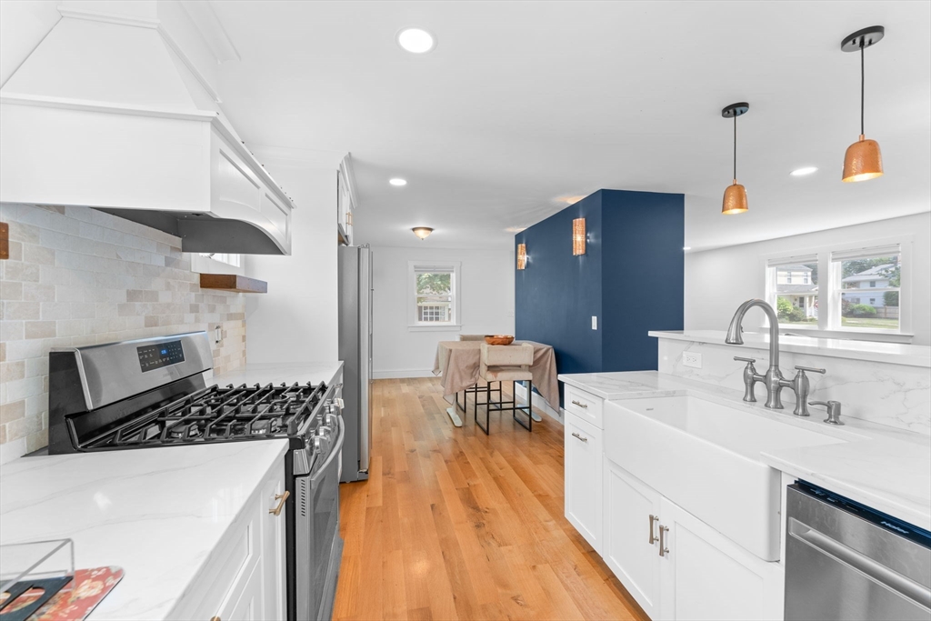 342 Franklin Street, Unit ST Framingham, MA 01702 - Photo 1 of 39 a kitchen with a sink a stove and chairs