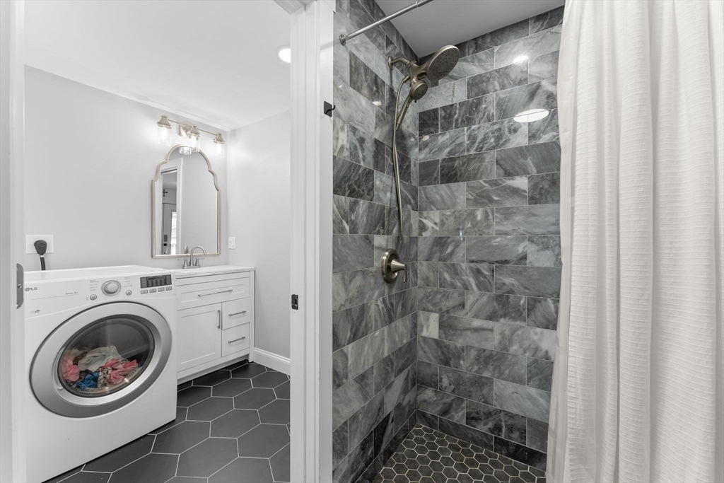 342 Franklin Street, Unit ST Framingham, MA 01702 - Photo 16 of 39 a bathroom with a shower a mirror and a shower