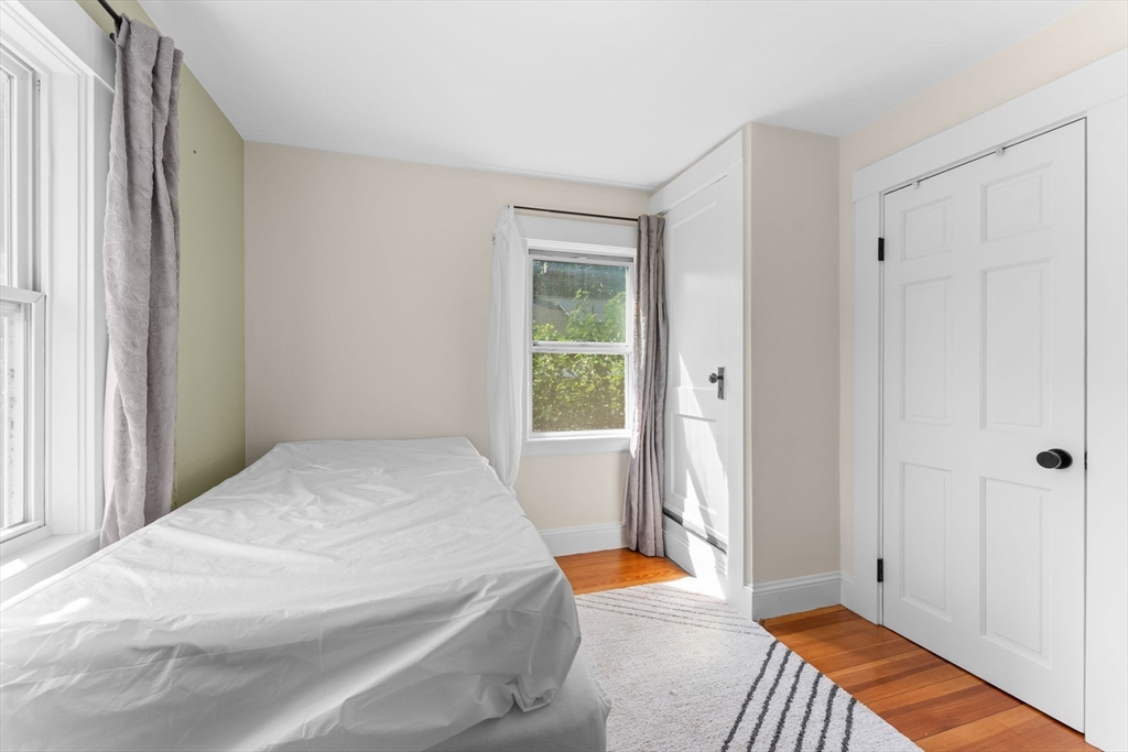 342 Franklin Street, Unit ST Framingham, MA 01702 - Photo 20 of 39 a bedroom with a bed and a window