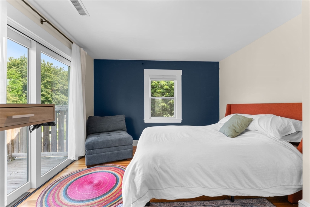 342 Franklin Street, Unit ST Framingham, MA 01702 - Photo 22 of 39 a bedroom with a bed and wooden floor