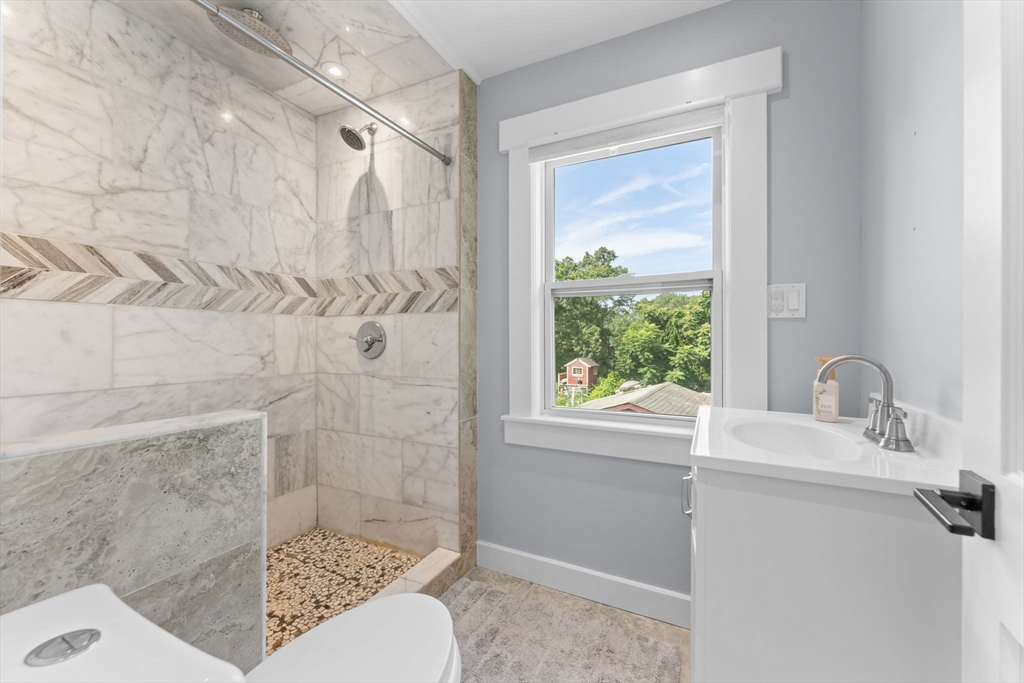342 Franklin Street, Unit ST Framingham, MA 01702 - Photo 23 of 39 a bathroom with a sink toilet and shower
