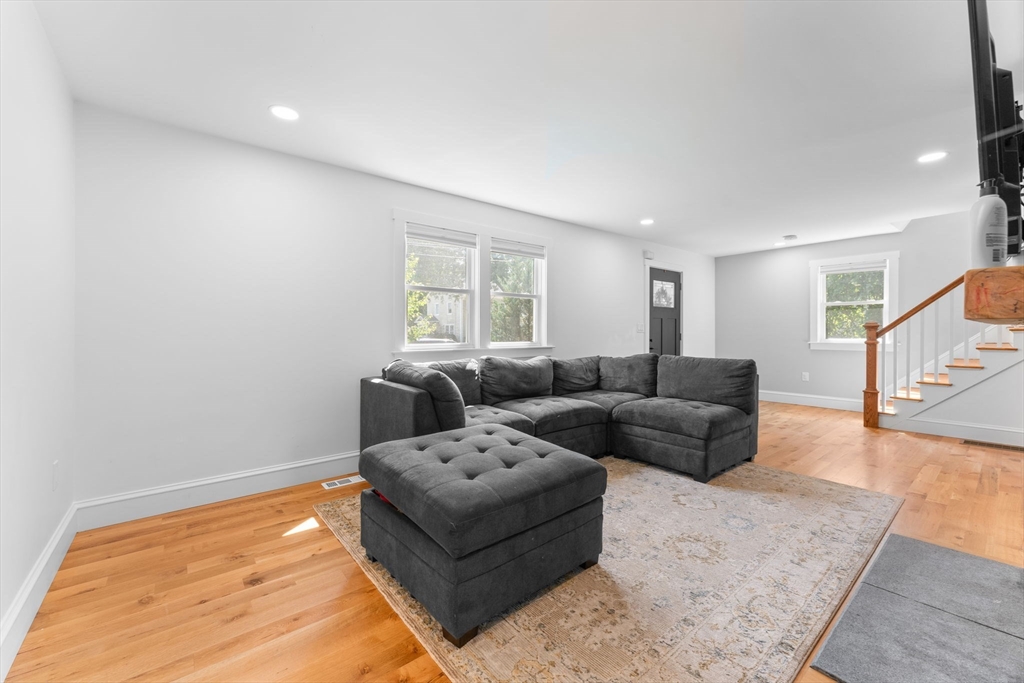 342 Franklin Street, Unit ST Framingham, MA 01702 - Photo 9 of 39 a living room with furniture and a rug