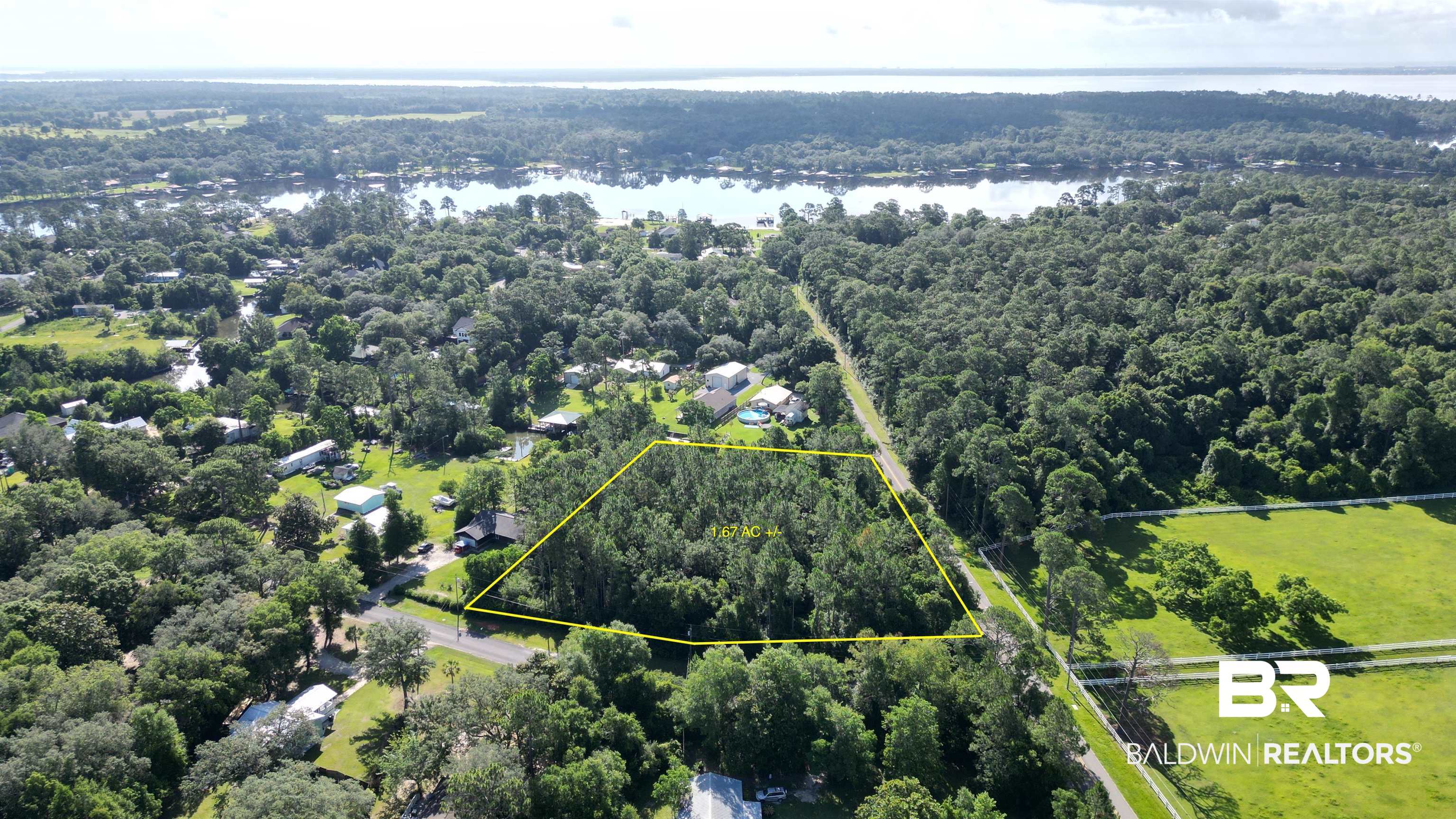 0 Bohling Street Elberta, AL 36530 - Photo 9 of 23 Aerial view of property and surrounding area with a large body of water and property boundaries highlighted