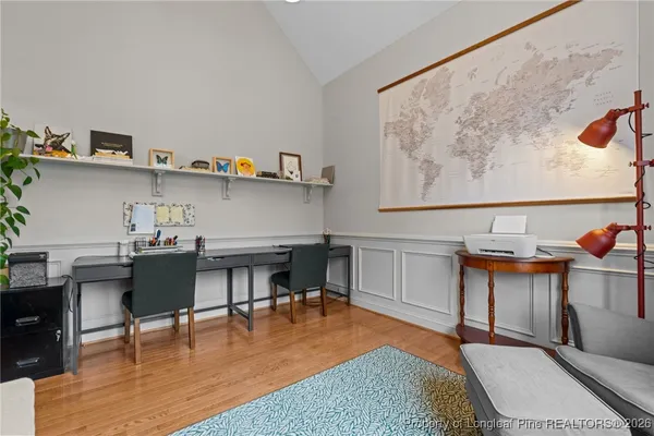 a workspace with furniture and wooden floor