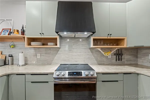 a kitchen with a stove and a sink