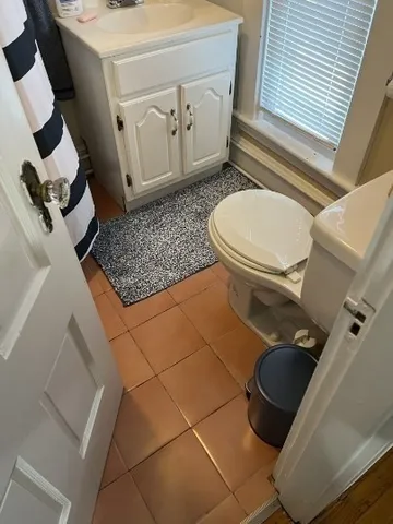 a bathroom with a toilet and a sink