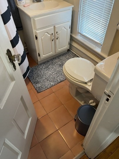 72 Linden Street, Unit 204 Reading, MA 01867 - Photo 3 of 4 a bathroom with a toilet and a sink