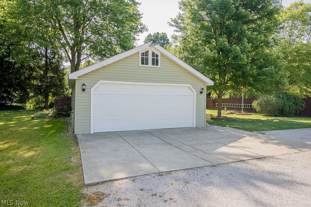 4181 Maple Street Perry, OH 44081 - Photo 6 of 20 20x29 garage with furnace, drywall, electric, work benches, lockers, and file cabinets all remain.