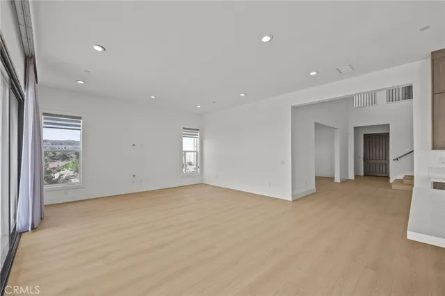 a kitchen with stainless steel appliances granite countertop a stove a sink a refrigerator and a oven