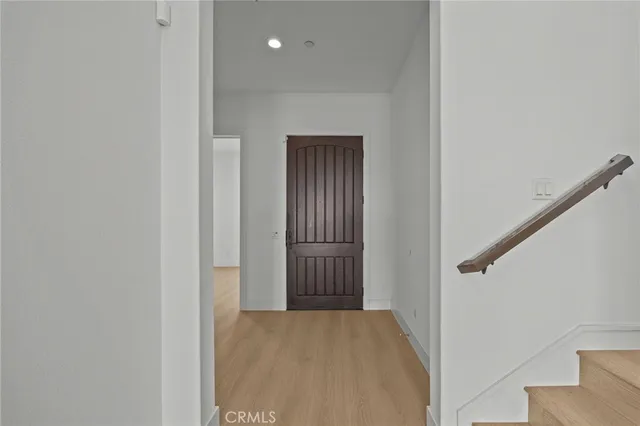 an empty room with large windows