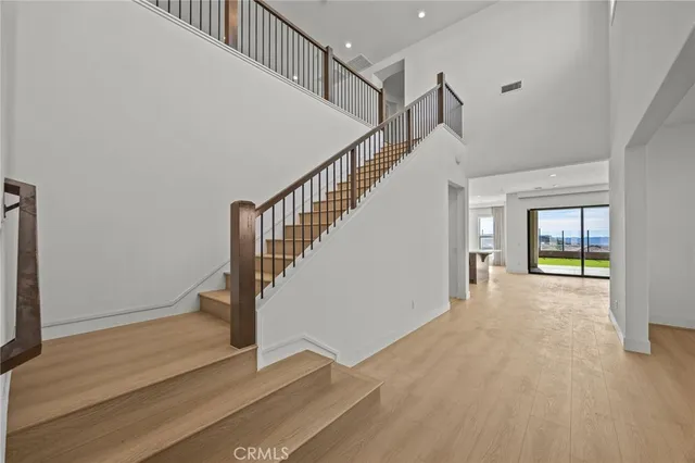 a view of an entryway with wooden floor