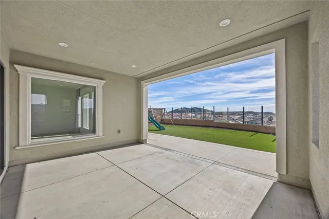 an aerial view of residential houses with city view