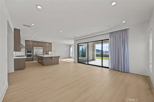 a view of kitchen with wooden floor