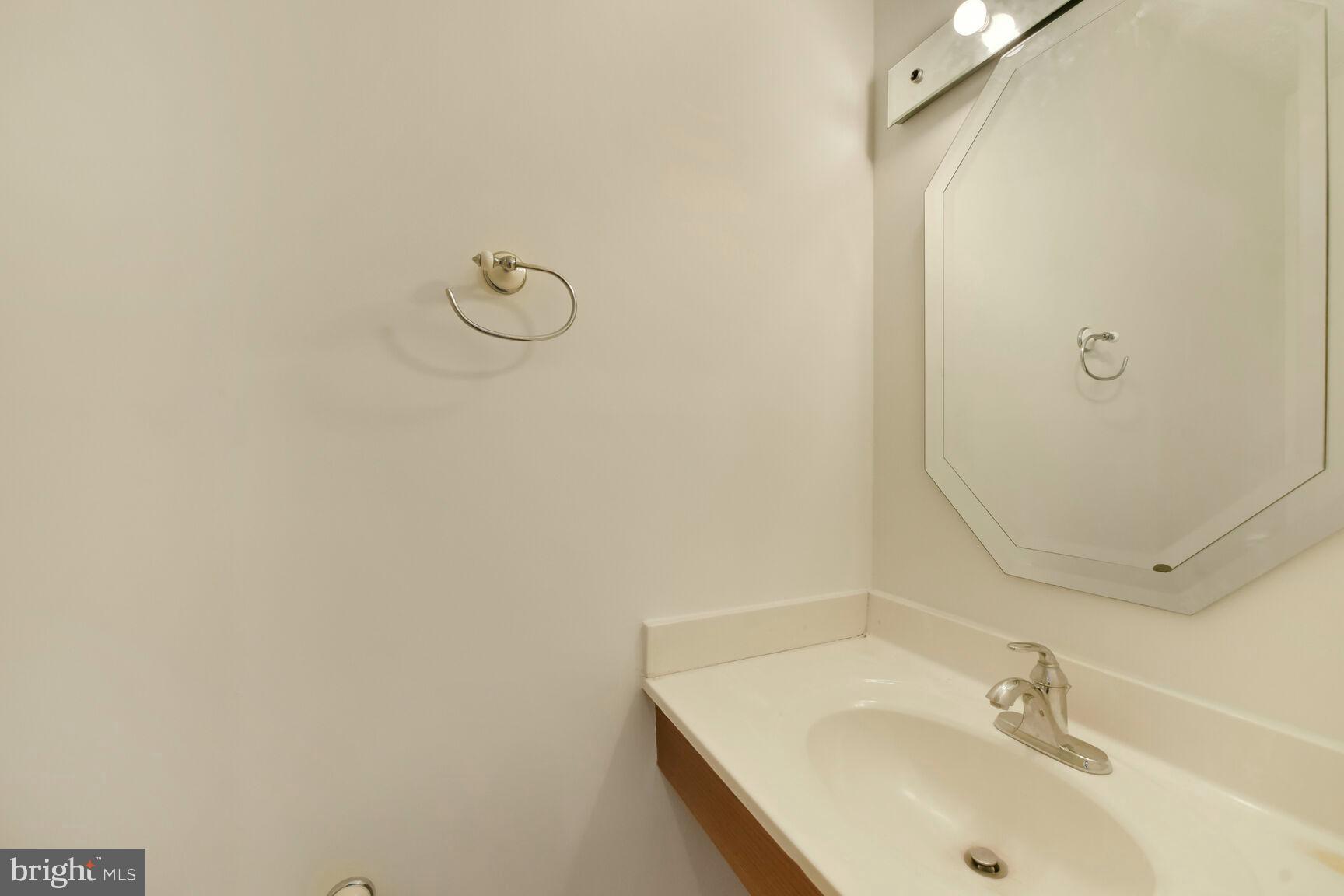 13417 Elevation Lane Herndon, VA 20171 - Photo 11 of 30 a bathroom with a sink and a mirror