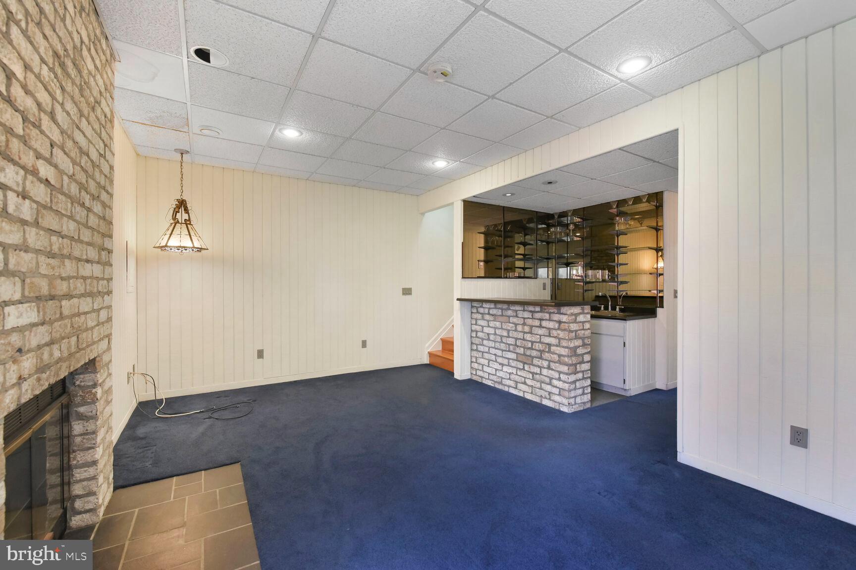 13417 Elevation Lane Herndon, VA 20171 - Photo 14 of 30 an empty room with wooden floor and natural light